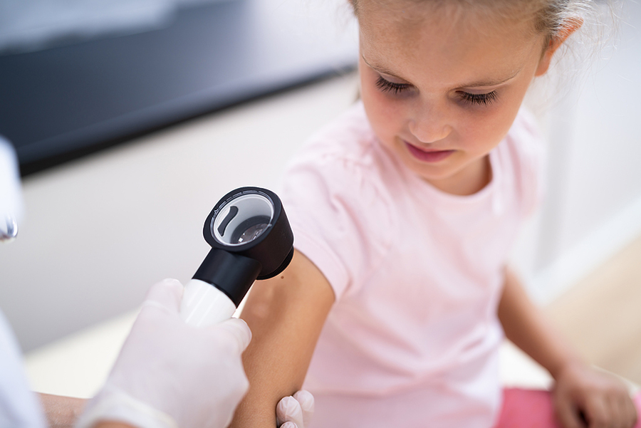 patient being checked with dermatology device