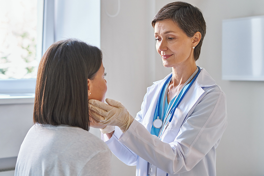 doctor examining patient